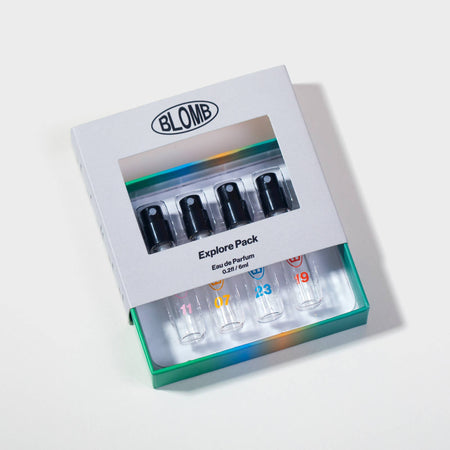 Blomb perfume explore pack with four small bottles on a light gray background