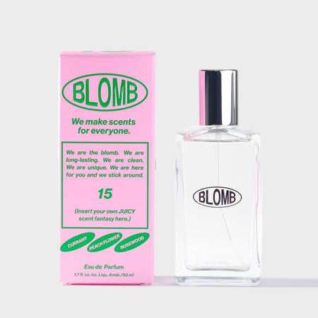 Blomb Eau de Parfum bottle and branded pink and green packaging on a white background