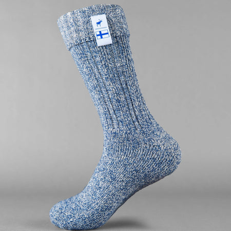 Baltic blue knitted Sisu of Finland socks with a Finnish flag brand label on a gray background. Lambswool and cotton rich to get you through the cold Arctic nights.