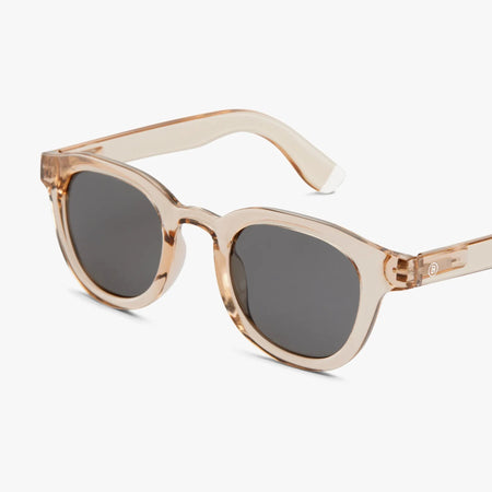 Pink sunglasses with dark lenses on a white background