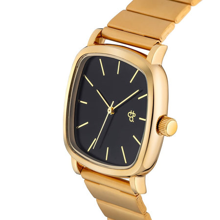 Gold watch with black face on a white background