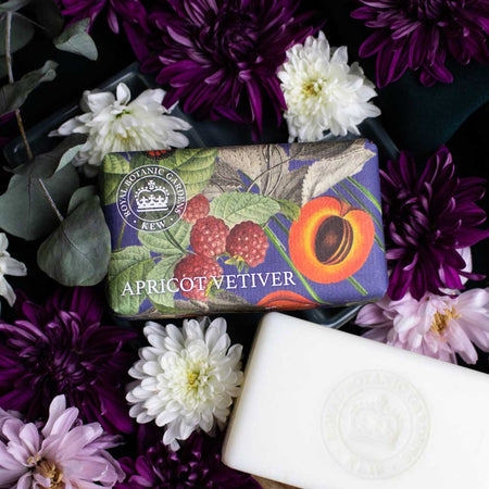Soap bar with Royal Botanic Gardens' Kew logo and wrapped in archival  illustrations surrounded by flowers
