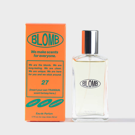 Blomb number 27 branded perfume bottle and orange and green packaging on a white background