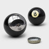 The Eight Ball Bottle Opener is part gadget, part icon, and 100% conversation starter. Crafted from a genuine black number eight pool ball. Bottle opener shaped like a pool ball with a silver cap on a white background