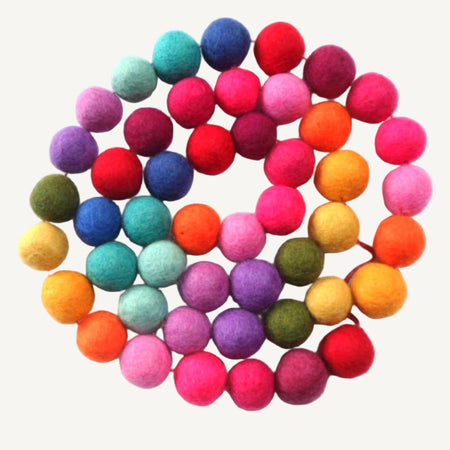 Multicoloured felt ball garland 130cm long on a white background