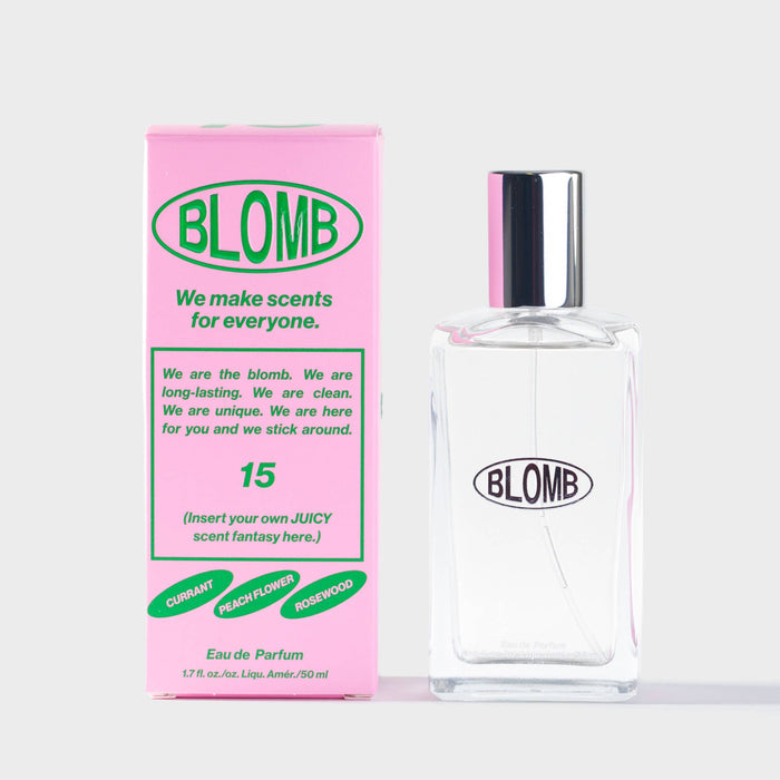 Blomb Eau de Parfum bottle and branded pink and green packaging on a white background