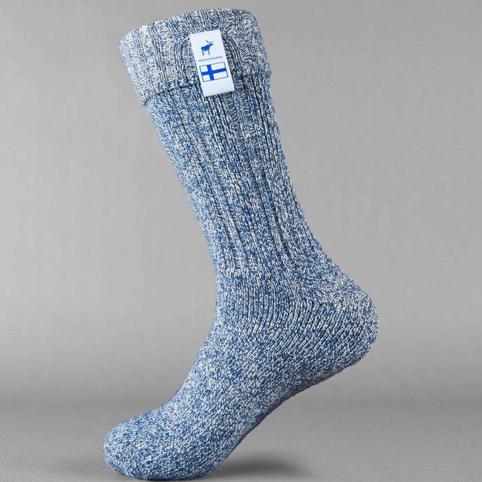Baltic blue knitted Sisu of Finland socks with a Finnish flag brand label on a gray background. Lambswool and cotton rich to get you through the cold Arctic nights.