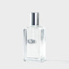 Clear Blomb branded perfume bottle with silver cap on a white background