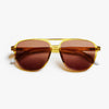 Olive-framed sunglasses with brown lenses on a white background