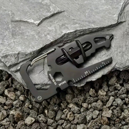 Multitool keychain on a stone surface