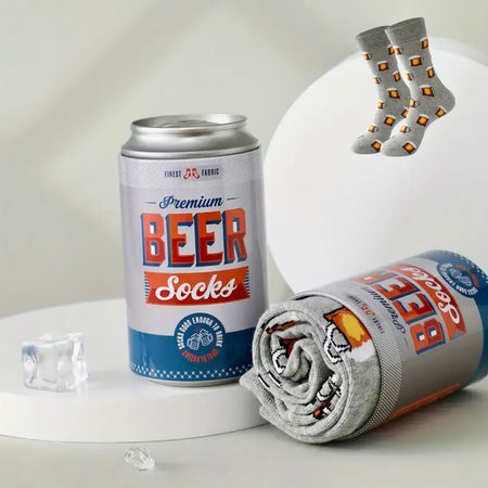 Can of 'Premium Beer Socks' with socks on a white surface