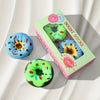Colorful donut-shaped socks with a box labeled 'Dount Socks' on a white background