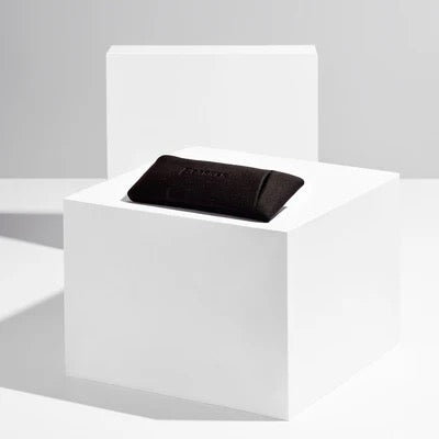 Black glasses case in a white box on a light gray background