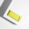 Yellow glasses case with brand logo on a white and gray background