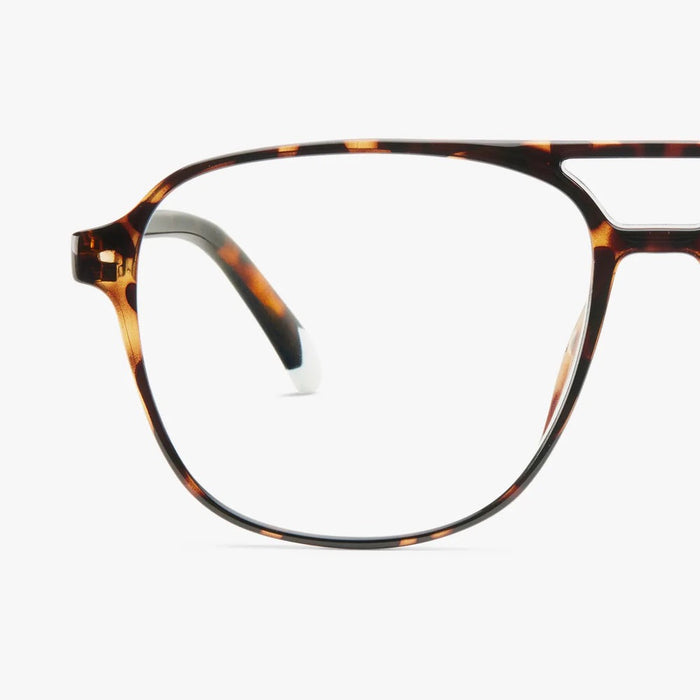 Tortoiseshell eyeglasses on a white background