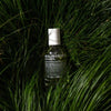 Malin+Goetz eau de parfum bottle on grass