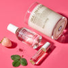 Malin+Goetz strawberry eau de parfum. Three skincare products with visible branding on a pink background