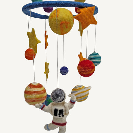 Colorful space-themed mobile with planets and an astronaut on a white background