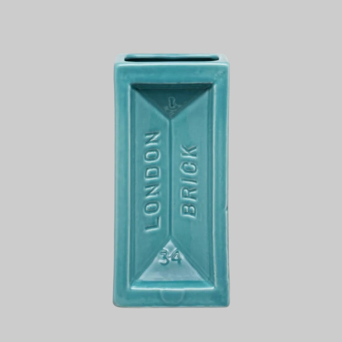 Turquoise rectangular vase with 'London Brick' text on a white background