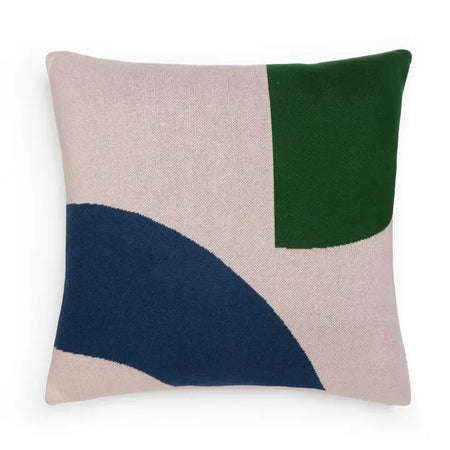 Decorative cushion with blush pink, green and cobalt geometric design on a beige background