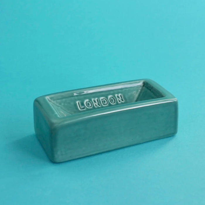 Turquoise London Brick soap dish with 'London' engraving on a turquoise background