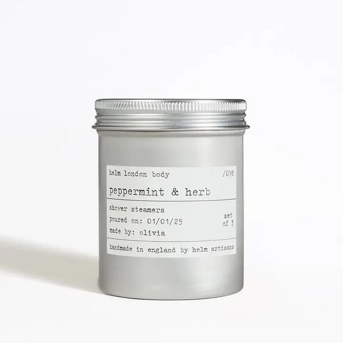 Aluminium screw top container of peppermint & herb shower steamers on a white background