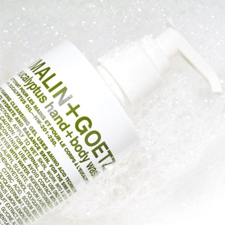 MALIN + GOETZ eucalyptus hand and body wash packaging with branding on a white background