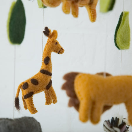Felt animal mobile with giraffe, lion, and zebra on a white background
