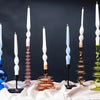 A selection of Maegen twisted candles in holders