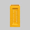 Yellow brick-shaped vase with 'Outwood Brick Works Manchester' text on a gray background
