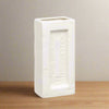 White rectangular vase with 'Outwood Brick Works' engraving on a wooden surface. Perfect for design lovers who appreciate function with an industrial edge.