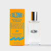 Blomb branded perfume bottle and orange and blue branded packaging on a white background