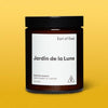 Candle jar labeled 'Jardin de la Lune' by 'Earl of East' on a yellow background