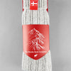Sky grey knitted Danish Hygge socks with a Danish flag brand label on a gray background. Lambswool and cotton rich to get you through the cold Arctic nights.