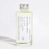 Bottle of Christmas Spice fragrance with a silver cap on a white background